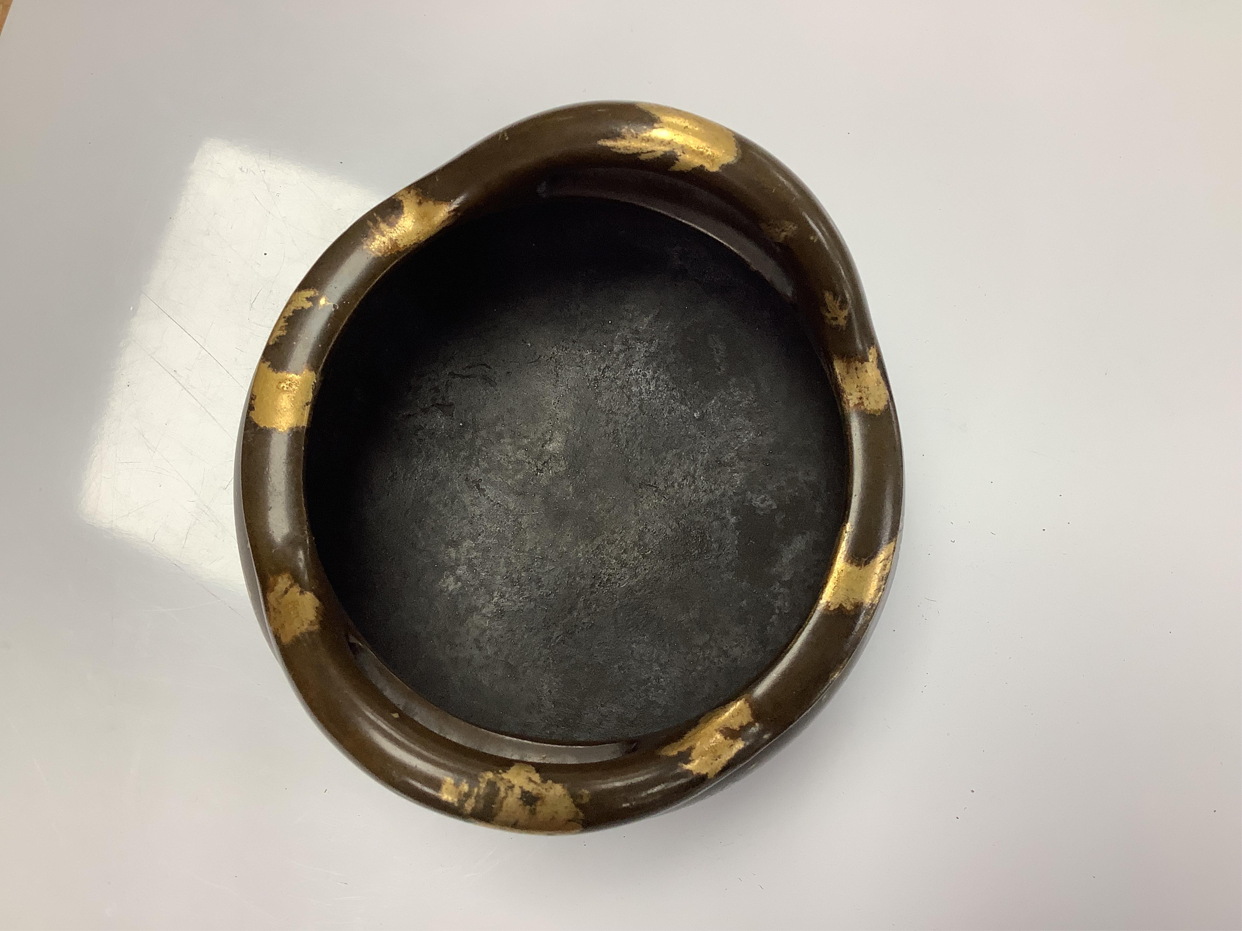 A Chinese gold splash bronze censer, Xuande seal mark to underside, 11cm wide. Condition - good